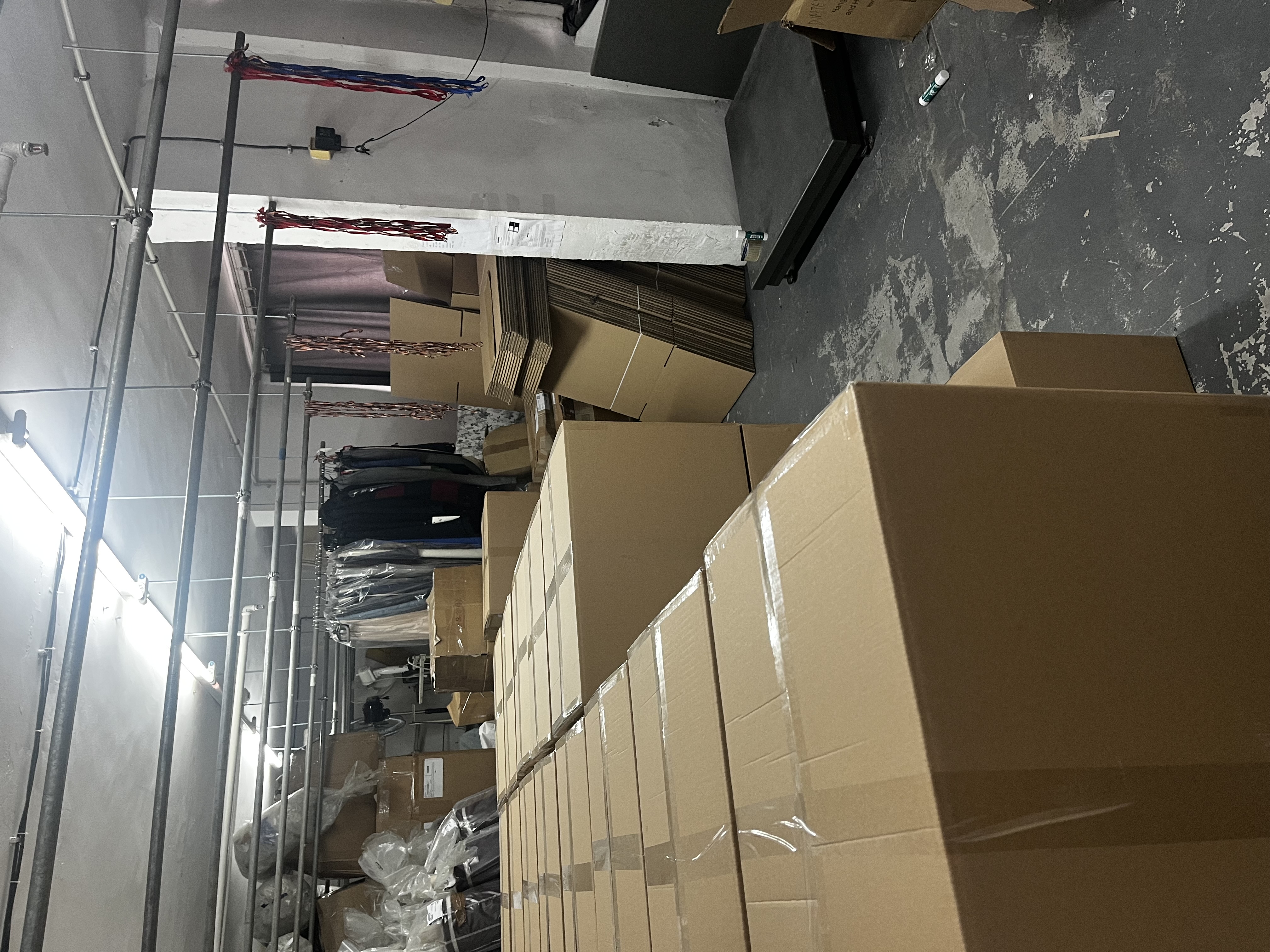 DIMTEX warehouse and packing area with cartons and garments