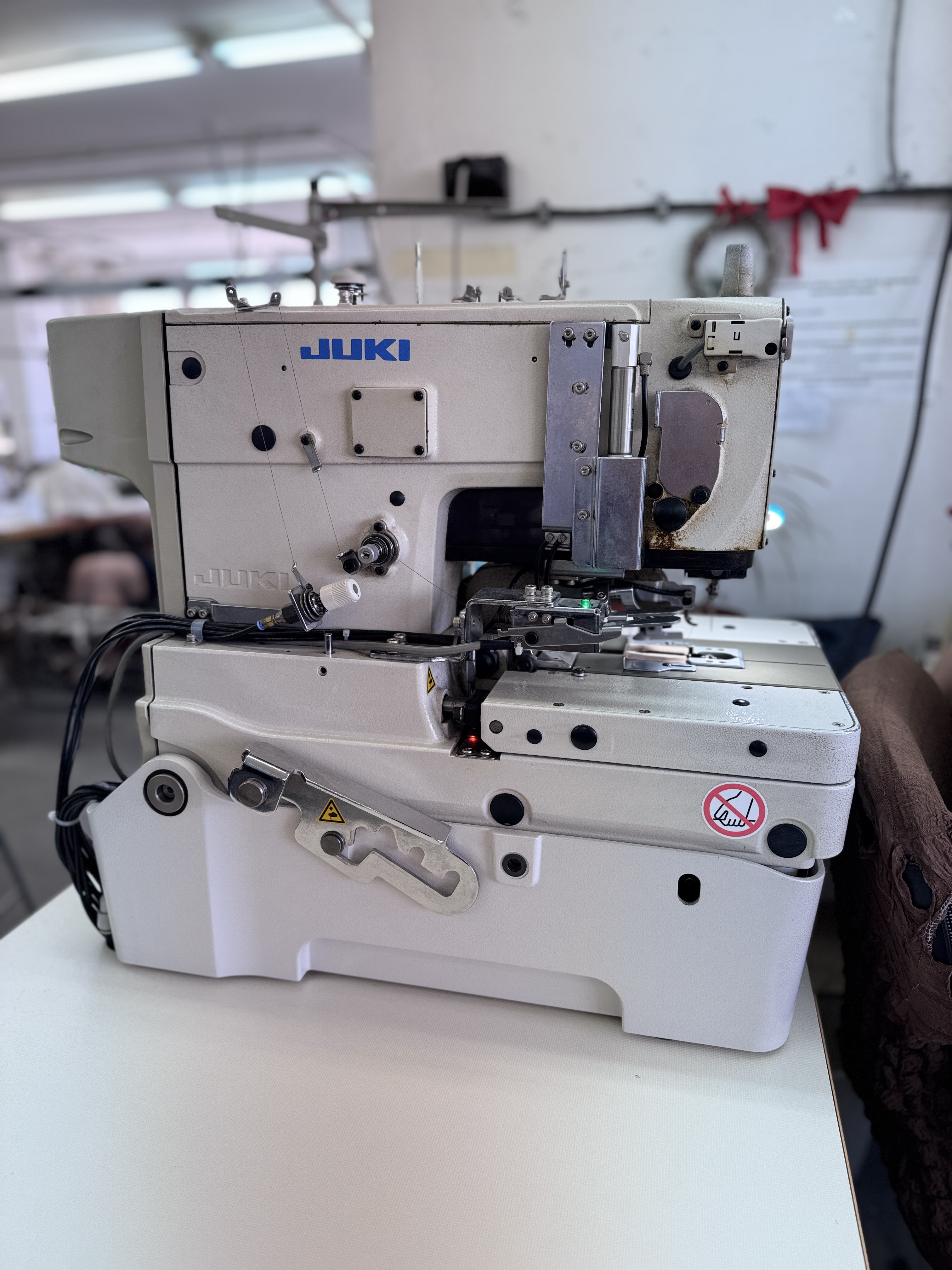 JUKI LK-1903 series button attaching sewing machine at DIMTEX